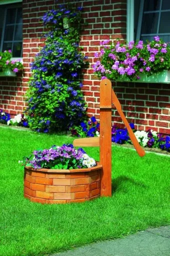 Round wooden trough with wooden handle pump