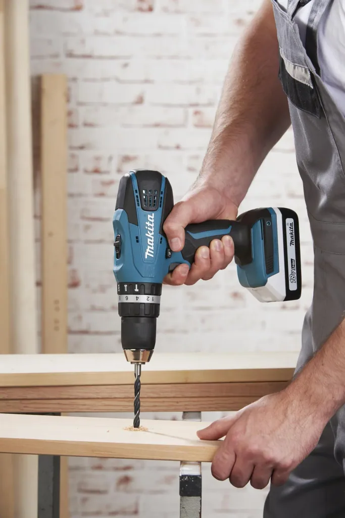 Cordless impact drill HP457DWE10, 18 Volt - 2-speed, Li-Ion with 74-piece accessories