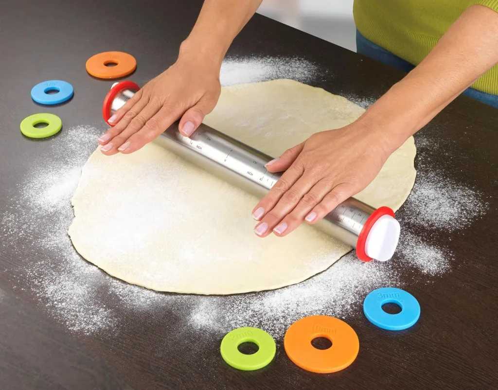 Stainless steel rolling pin with spacers and measuring scale