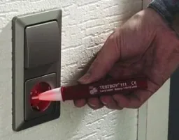 Voltage tester 111 with optical & acoustic signal & light